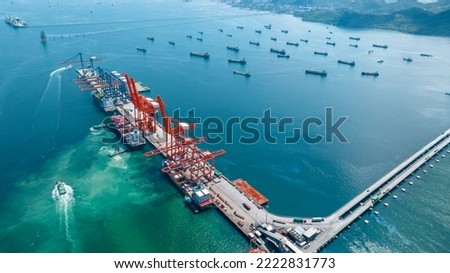 Cargo container Ship running to Bridge Cargo Shipyard Container ship under the crane Sea Port service logistics and transportation. International Shipping Depot Customs Port for import export trade.  Royalty-Free Stock Photo #2222831773