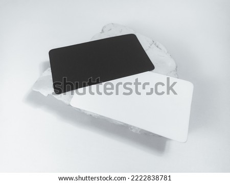 Blank business card on marble stone, 3d rendering. Business card design mockup. Call sheet template for company name, phone number, email address.