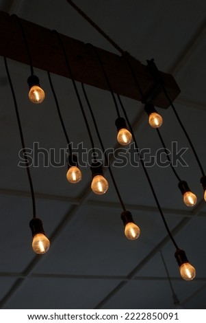 a simple but beautiful chandelier, a mix of scrap wood, scrap rope and a few lights strung into a string.