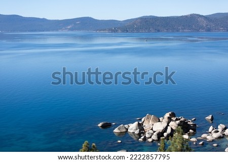 
Sand Harbor beach in Lake Tahoe blue clear water with boulders and rocks and trees Royalty-Free Stock Photo #2222857795