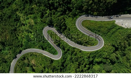 aerial view ROAD No.1081 of winding mountain road between Pua Ddistric, Nan Province, Thailand is highlignt that tourist like to take pictures of because of the beauty of the road.