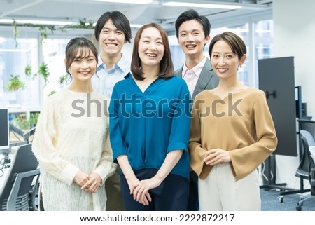 Japanese men and women looking at the camera with a smile Royalty-Free Stock Photo #2222872217