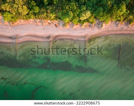 Top down view of beach at sunrise by Baltic sea, Poland, Europe