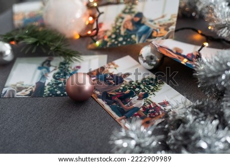 Photos of family against Christmas lights decor background