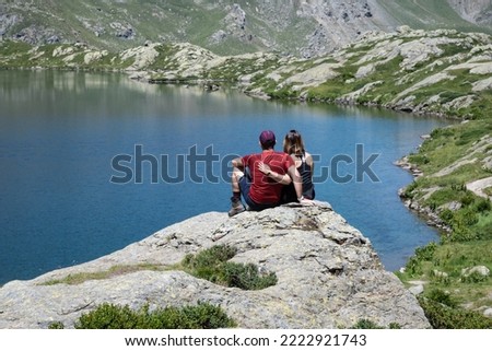 Small alpine lake called "Lago Superiore" nestled in the Cozie alps at the foot of Monviso in Piedmont in Italy.