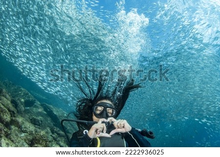 beautiful latina mexican girl diving in cortez sea mexico