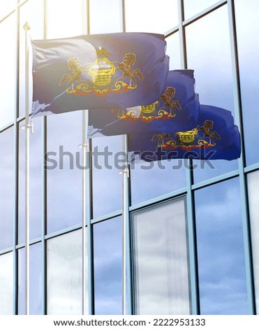 Flagpoles with the flag of State of Pennsylvania in front of the business center