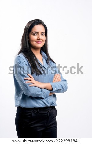 Young indian businesswoman or employee standing on white background. Royalty-Free Stock Photo #2222981841