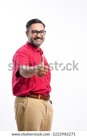 Indian man showing thumps up on white background. Royalty-Free Stock Photo #2222982271