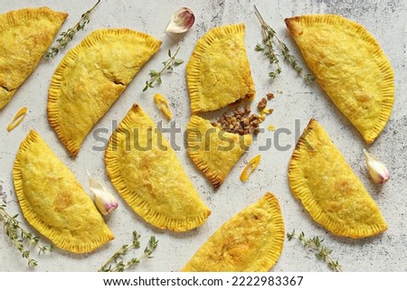  Jamaican Beef Patties. Authentic Jamaicam meat pies. Flat layot Royalty-Free Stock Photo #2222983367