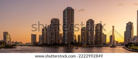 Panoramic view of Tokyo High rise condominium and Sumida river at golden hour.