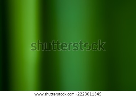 Green defocused abstract smooth asymmetric gradient background