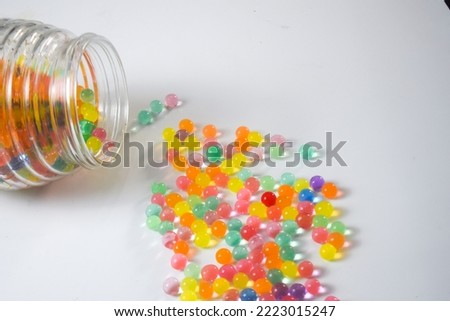 blurry colorful water balls on a white background, water balls are used for plant growing media, also used to train children's sensory