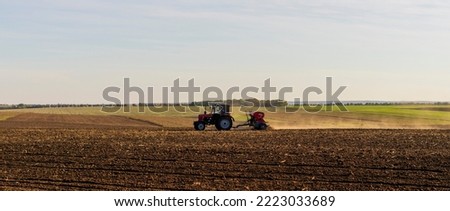 Tractor plows the field before winter