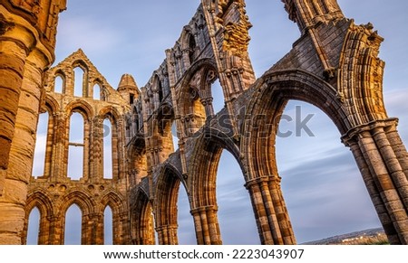 Sunset view of Whitby abbey overlooking the North Sea on the East Cliff above Whitby in North Yorkshire, England, UK Royalty-Free Stock Photo #2223043907