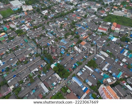 Aerial view of residential neighborhood roofs. Urban housing development from above. Top view. Real estate in Bangkok City, Thailand. Property real estate.