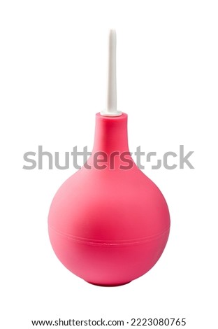 Pink medical douche pear isolated on white background. Close-up studio shot. Royalty-Free Stock Photo #2223080765