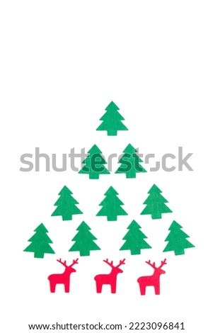 Gift wrapping option in the form of a felt Christmas tree. Christmas bright composition. Christmas background for presentation of work or text. Copy space. Top view. Isolated