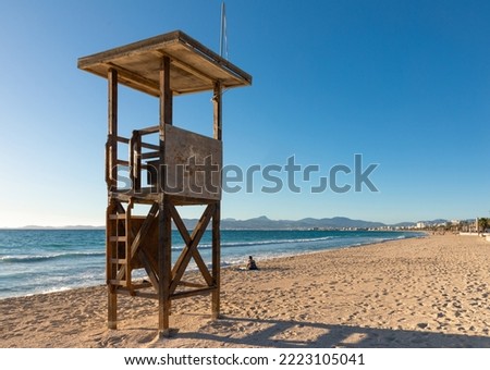 Beach watchtower in Playa de Palma de Mallorca, at sunset on an autumn day. Royalty-Free Stock Photo #2223105041
