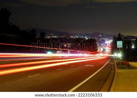 A Slow Shutter View of Traffic on a Hill at Night