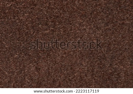 Brown color wool textile texture macro close up view
