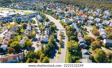 Aerial view of upscale residential area, gated community street real estate with single family homes. Autumn sunny day. Royalty-Free Stock Photo #2223132249