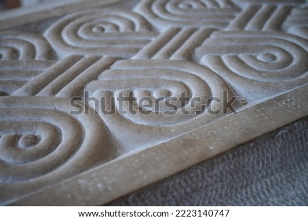 Spiral, geometric shapes, carved in the stone, made in stonemason academy in town of Pucisca, Croatia Royalty-Free Stock Photo #2223140747