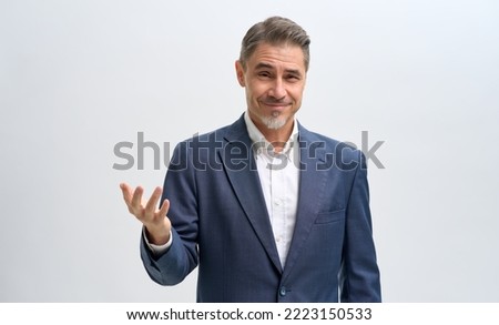Business portrait of confident businessman, salesman. Entrepreneur in jacket, smiling, Happy mature man with facial expression asking, solving problem, showing it is easy. Royalty-Free Stock Photo #2223150533