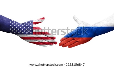Handshake between Russia and USA flags painted on hands, isolated transparent image.