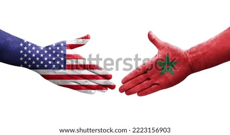 Handshake between Morocco and USA flags painted on hands, isolated transparent image.