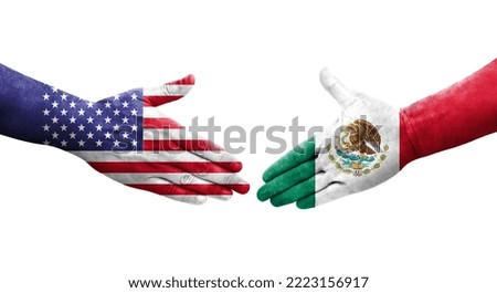 Handshake between Mexico and USA flags painted on hands, isolated transparent image.