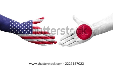 Handshake between Japan and USA flags painted on hands, isolated transparent image.