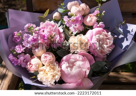 Beautiful rich elegant soft wedding pink violet purple yellow bouquet with rose, peony in sunlight