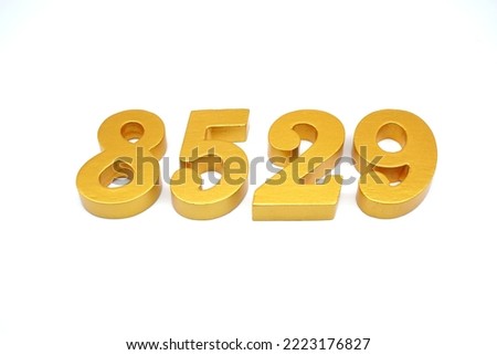  Number 8529 is made of gold-painted teak, 1 centimeter thick, placed on a white background to visualize it in 3D.                                     