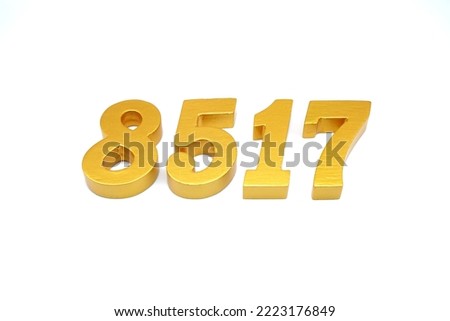   Number 8517 is made of gold-painted teak, 1 centimeter thick, placed on a white background to visualize it in 3D.                              