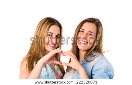 Friends make a heart with her hands over white background 