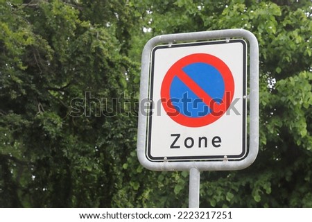 No parking sign includes a zone.