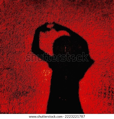 A shot of the shadow of a girl drawing a heart with her fingers