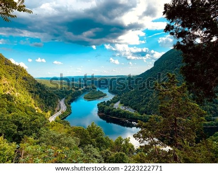 Delaware Water Gap National Recreation Area get on a stretch of the River on the New Jersey and Pennsylvania border. It encloses grassy beaches, forested mountains and slices through Kittatinny Ridge. Royalty-Free Stock Photo #2223222771