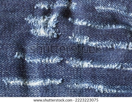 Jeans fabric texture. High-quality stock photo. The connection of the fibers of the fabric.