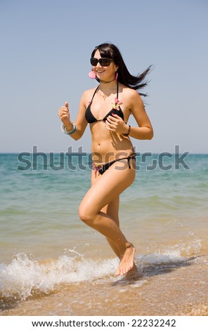 Girl running on seashore