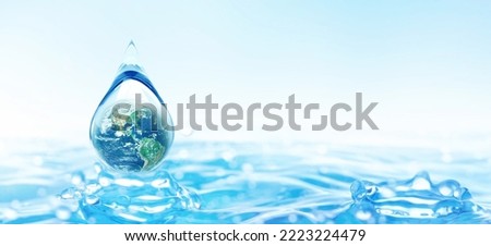 World Water Day concept with world in clean water drop on and fresh blue water ripples design, Environment save and ecology theme concept, Elements of this image furnished by NASA Royalty-Free Stock Photo #2223224479