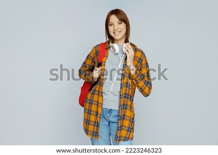 Concept of people, student girl on light gray background