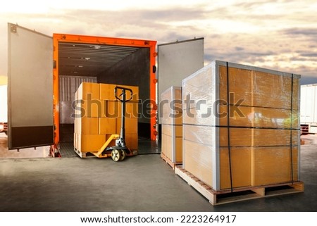 Packaging Boxes Stacked on Pallets Loading into Cargo Container. Delivery Shipping Trucks. Supply Chain Shipment Goods. Distribution Supplies Warehouse. Freight Truck Transport Logistics Royalty-Free Stock Photo #2223264917