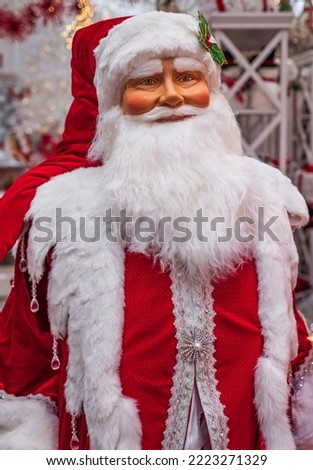 Santa Claus doll with presents. Lovely Merry Christmas and Happy new Year 2022 with Santa Claus doll. Nobody, selective focus