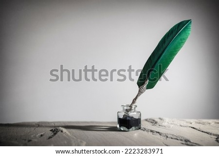 Quill pen and inkwell background concept for literature, writing, author and history
