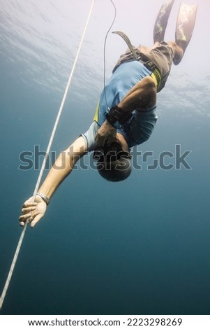 free diver training in a reef Royalty-Free Stock Photo #2223298269