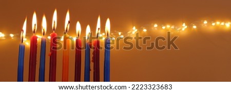 Image of jewish holiday Hanukkah with menorah (traditional candelabra) and candles