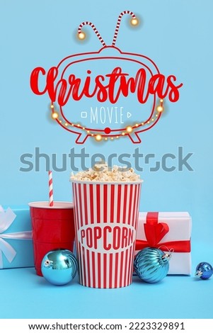 Banner with popcorn, soda drink, Christmas balls and gifts on blue background. Christmas celebration