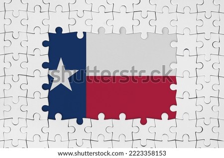 Texas US state flag in frame of white puzzle pieces with missing central parts
